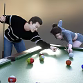 Two People Playing Billiards With Cue Sticks On Billiard Table 3d model