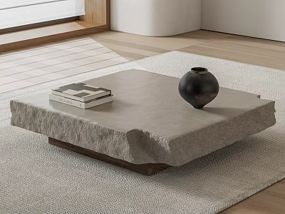 Natural Gray Stone Coffee Table With Stacked Books And Black Vase On Light Rug 3d model