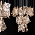 Modern Artistic Chandelier with Transparent Irregular Shapes and Warm Glow for Interior Decoration