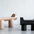 Two Modern Minimalist Stools With Light And Dark Wooden Cylindrical Legs