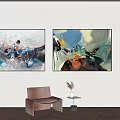 Abstract Paintings On Wall With Brown Chair Small Table And Green Plant