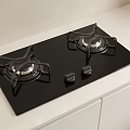 Modern Black Glass Gas Cooktop With Two Burners On White Kitchen Counter