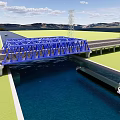 Blue Steel Structure Bridge Over Water With Boat Roads Green Fields And Mountains
