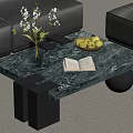 Green Marble Coffee Table with Black Legs Vase White Flowers Fruit Bowl and Open Book