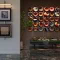 Colorful Circular Wall Decor Arranged On Wooden Wall With Green Plant And Marble Floor