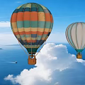 Colorful and White Hot Air Balloons Flying Over Blue Sky White Clouds and Sea