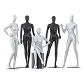 Multiple White And Black Mannequins In Standing And Sitting Poses