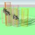 Outdoor Commercial Display Equipment Featuring Transparent Yellow Cylinders In Garden With Green Plants