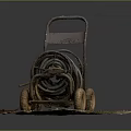 Rusted Garden Cart With Coiled Old Hose On Dirt Surface