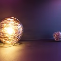 Multiple Sizes Spherical Wire Wrapped Decorative Lights With Warm Glow On Purple Background