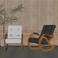Beige Upholstered and Dark Leather Rocking Leisure Chairs by Wooden Perforated Wall with Potted Plant