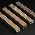Five Natural Stone Wood Elongated Pieces With Various Colors And Textures On Dark Background