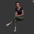 Woman Sitting On Dark Cube Holding Coffee Cup In Black T-Shirt Green Pants White Sneakers