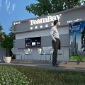Garden Landscape with TeamBay Booth 2024 Green Plants White Chairs Tables and Blue Sky