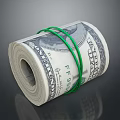 Rolled US Dollar Bills Secured With Green Rubber Bands On Dark Background