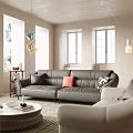 Modern Gray Leather Sectional Sofa Set With Orange And Patterned Pillows In Bright Living Room