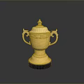 Ornamental Golden Trophy With Lid Handles Engraved Details And Black Base
