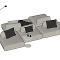 Modern White Sectional Sofa With Grey Cushions Black Throw Blanket And Floor Lamp