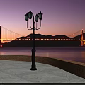Illuminated Golden Gate Bridge at Twilight with Calm Water Street Lamp and Mountain Views