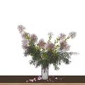 Pink Flowers in Green Vase with Scattered Petals on Wooden Table White Background