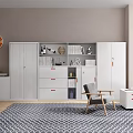 Modern White Bookcase With Drawers And Cabinets Featuring Gray Chair Geometric Rug And Orange Clock