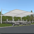 Modern White Carport Canopy Structure Covering Multiple Cars In Outdoor Parking Area With Green Trees