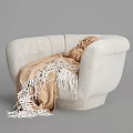 White Plush Accent Chair with Knitted Beige Cushion and Tasseled Blanket
