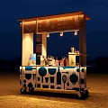 Illuminated Mobile Food Cart Design With Blue White Kitchen Utensil Patterns At Night