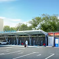 Parking Lot With EV Charging Stations Modern Solar Canopy Green Trees And Cars