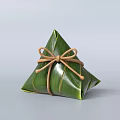 Traditional Chinese Zongzi Wrapped in Green Bamboo Leaves Tied with Brown String in Triangular Shape
