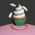 Cupcake With White Whipped Cream Green Liner Pink Base And White Decorative Pieces