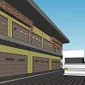 Multi Story Industrial Building Exterior Featuring Yellow Brown Garage Doors White Truck And Person