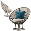 Modern Stylish Rattan Lounge Chair with Beige Cushion and Blue Decorative Pillow