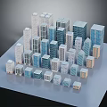 Modern Architecture Models With Various Heights Designs In Blue White Beige Arranged On Flat Surface
