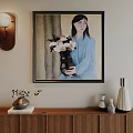 Framed Abstract Painting On Wall With Woman Holding Flower Vase And Wooden Cabinet Decorative Items