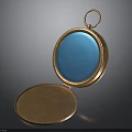 Open Vintage Gold Locket With Blue Circular Surface And Brown Inner Plate