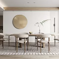 Modern Dining Room Interior With Round Brass Mirror Wooden Table Dining Chairs And Plant Rug