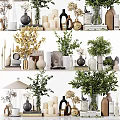 Elegant Ornamental Decor Arrangement With Green Plants Vases Candles Books And Decorative Sculptures