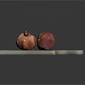 Gray Wooden Cutting Board With Two Fresh Ripe Pomegranates On Top