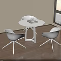 Modern White Round Meeting Table And Chairs By Window With City Sunset View