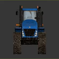 Blue Tracked Agricultural Tractor With Muddy Tracks And Heavy Duty Design
