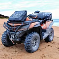 Orange and Black Off Road Motorcycle Parked On Sandy Beach With Ocean Background