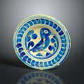 Antique Ceramic Plate Featuring Carved Bird Motif And Blue White Decorative Rim