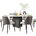 Round Marble Top Dining Table Set With Gray Chairs And Decorative Elements