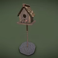 Wooden Birdhouse With Sloped Roof And Stone Base For Garden Birds