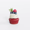 Red Cupcake With White Frosting Topped With Blueberries Raspberry And Green Garnish