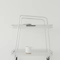 Two Tier White Metal Shelf Featuring Black Small Item And White Cup On White Background