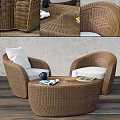 Rattan Outdoor Sofa with White Cushions and Round Coffee Table in Cozy Setting
