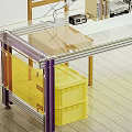 Office Desk With Glass Top Purple Legs Yellow Storage Bins Desk Lamp Books And Documents