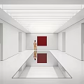 Long Corridor With Gray Carpet And Walls Red Circular Decorations Red Square Painting Person Standing